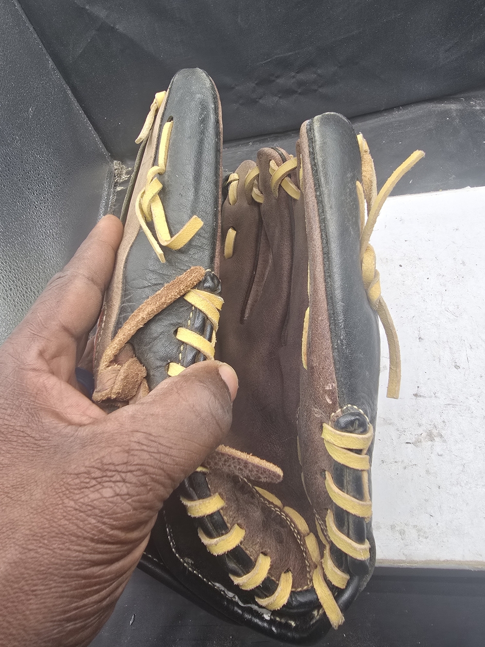 Rawlings Black and Brown Youth Baseball Glove with Yellow Laces